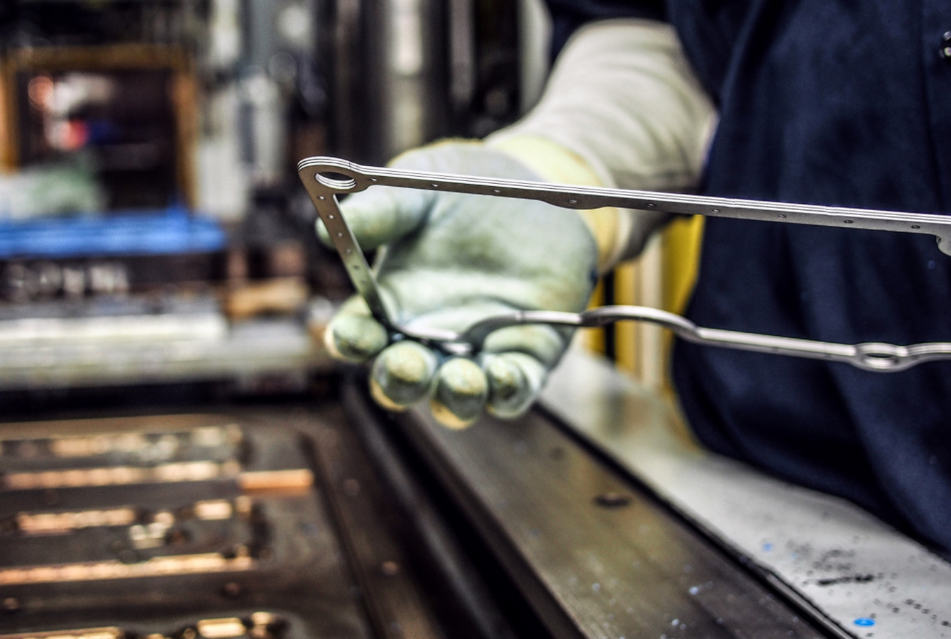 Worker Examining Auto Gasket