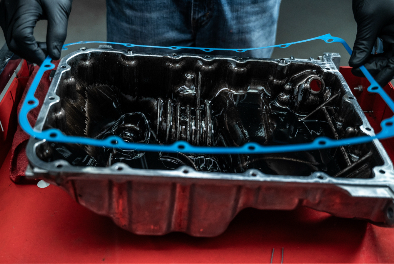 Auto Mechanic Installing Valve Cover Gasket