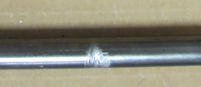 Damage to pushrod caused by interference with gasket pushrod guide Damage to pushrod caused by interference with gasket pushrod guide